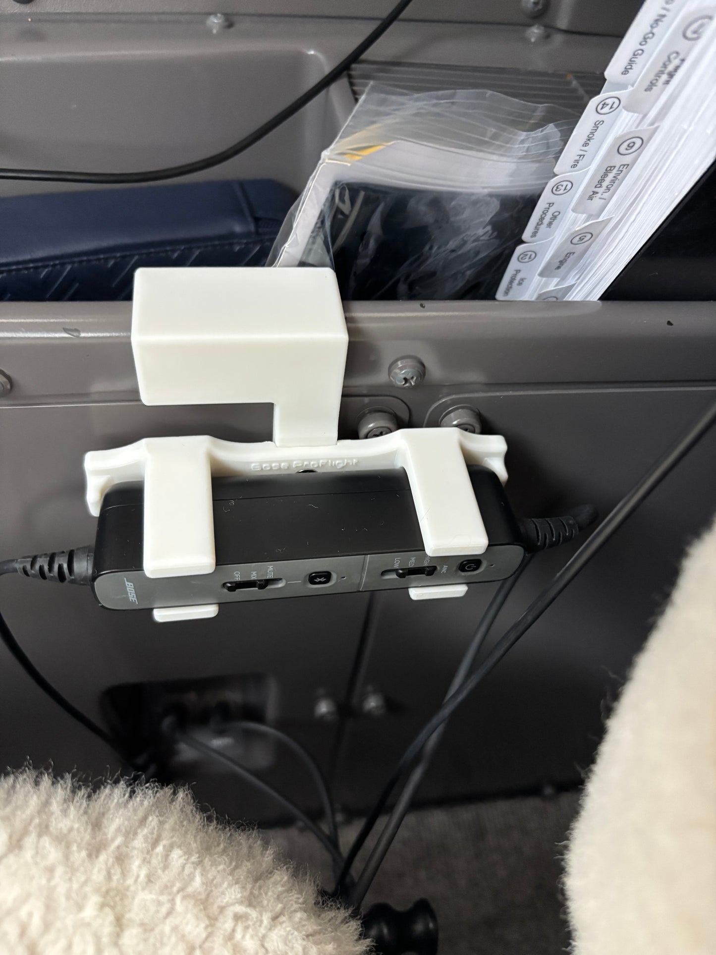 Bose ProFlight headset control mount installed in a Bombardier corporate jet cockpit sidewall